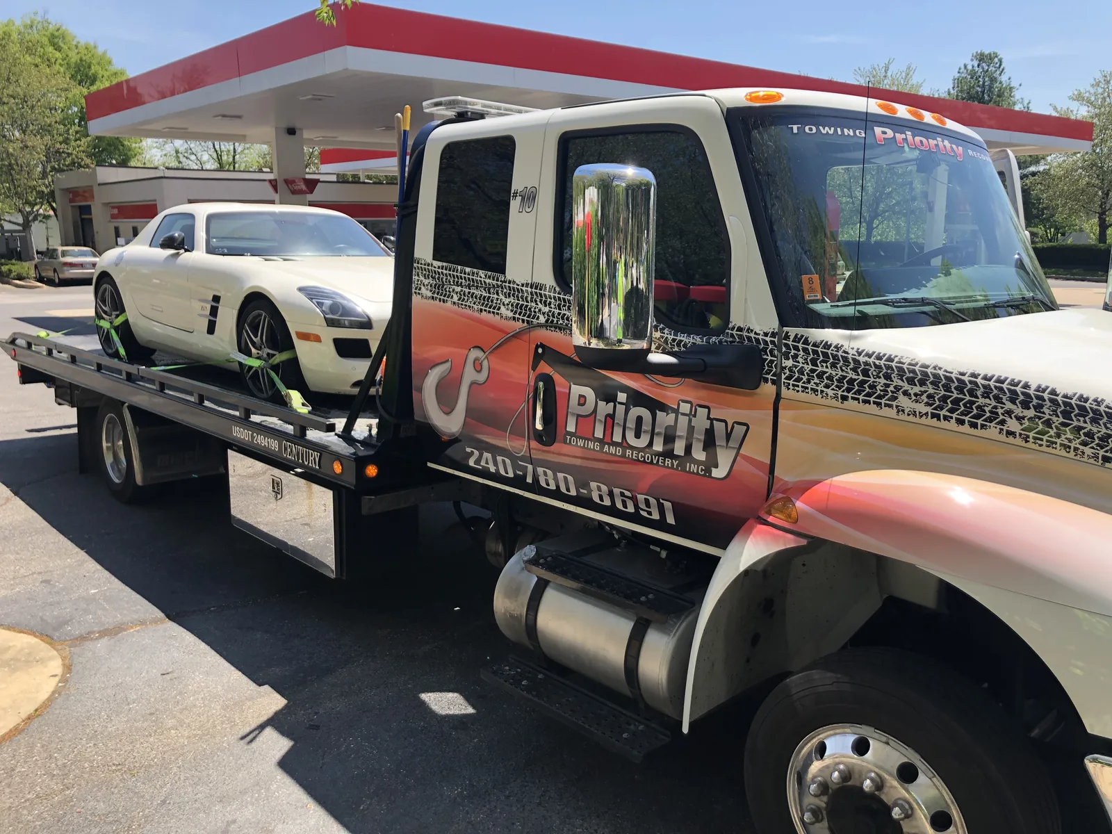 Exotic car on a Priority Towing rollback